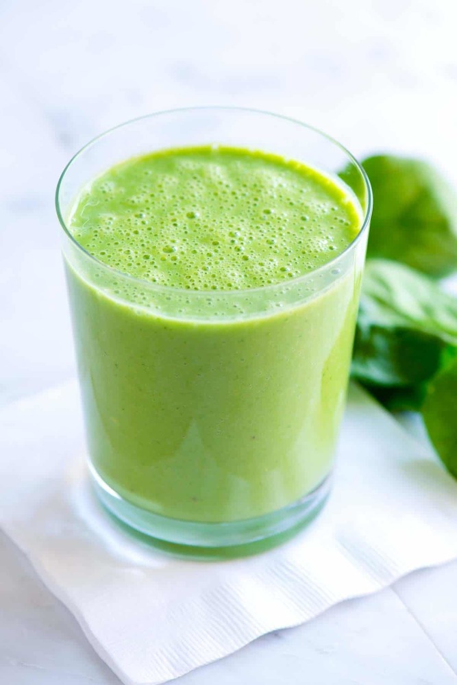 Glass full of green smoothie